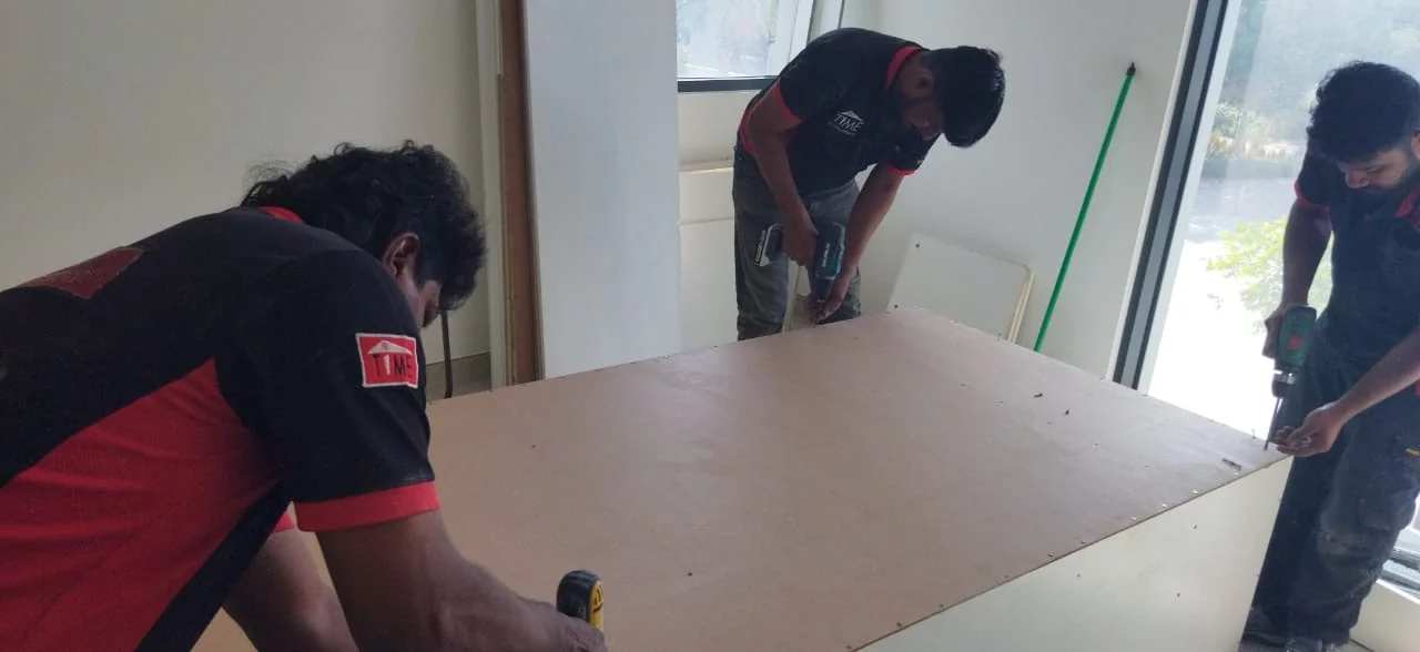 Time Furniture installation team assembling joinery on site