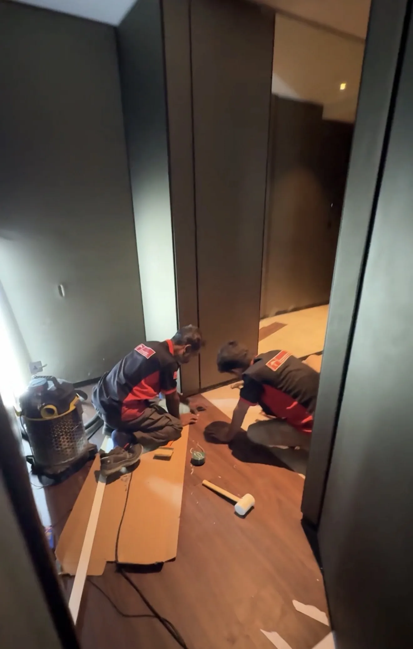 Time Furniture team installing engineered timber flooring on a Dubai project