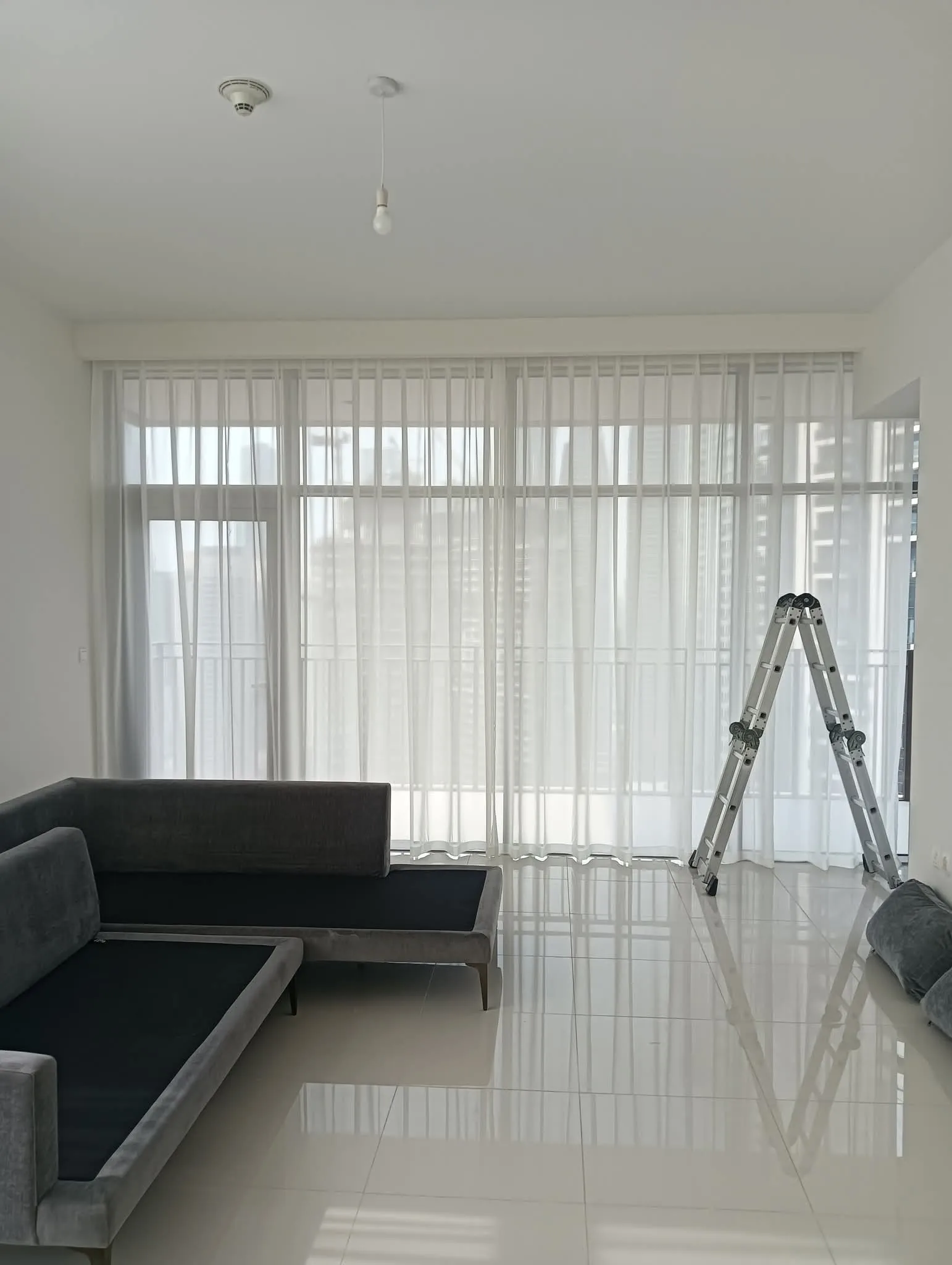 Sheer curtains in a luxury Dubai living room by Time Furniture